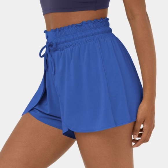 Halara stretchy blue shorts with tie at waist and flowy panels at the front - Picture 1 of 8